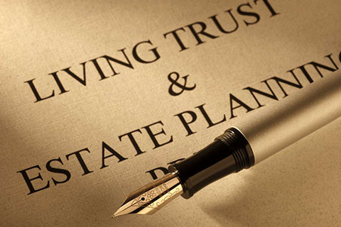 paper with the words living trust & estate planning written on it